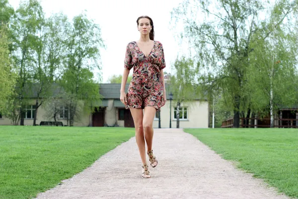 stock image Beautiful girl walks in outdoor