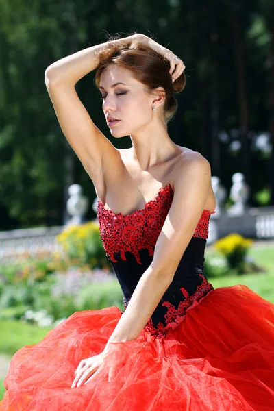 Lady in red dress — Stock Photo, Image