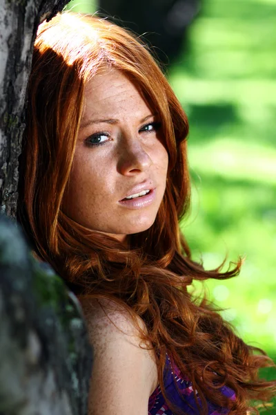 Portrait of a beautiful, daring red-haired girl — Stock Photo, Image