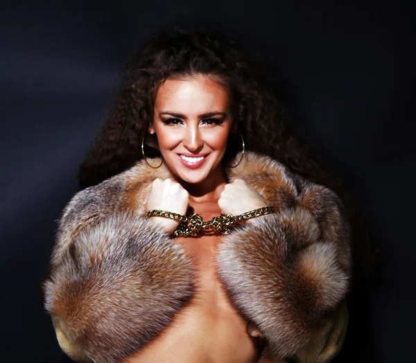Sexual model in a fur coat — Stock Photo, Image