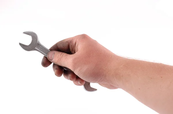 Uma chave metálica está em uma mão — Fotografia de Stock