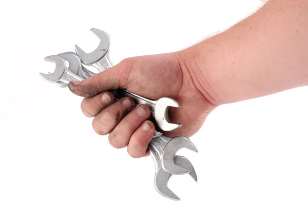 A metallic wrench is in a hand — Stock Photo, Image