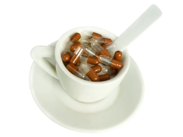 Tabletták vannak egy csésze — Stock Fotó