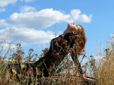 Girl sunbathes under the summer sun clipart