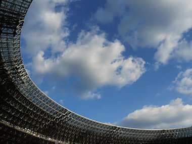 Roof of arena against the blue sky clipart