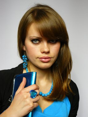 Brown-haired woman with a blue brilliant clipart