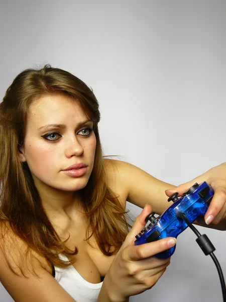 Woman plays video game — Stock Photo, Image