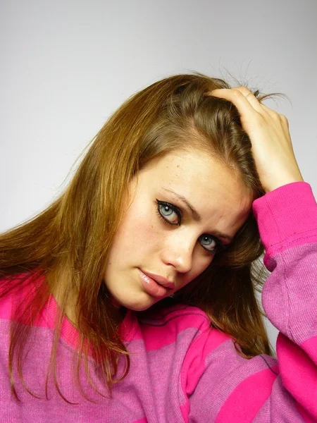 Girl in a pink sweater — Stock Photo, Image