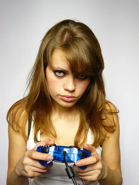 Girl plays video game — Stock Photo, Image