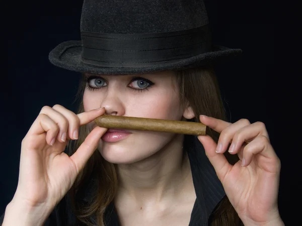 Graceful lady in black and a cigar — Stock Photo, Image