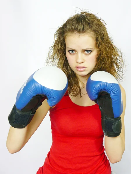 Young nice sportswoman in boxing gloves — Stock Photo, Image