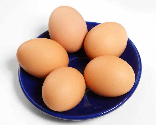 Five eggs on a dish — Stock Photo, Image