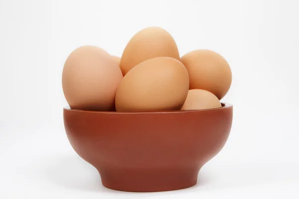 Ceramic bowl with eggs — Stock Photo, Image