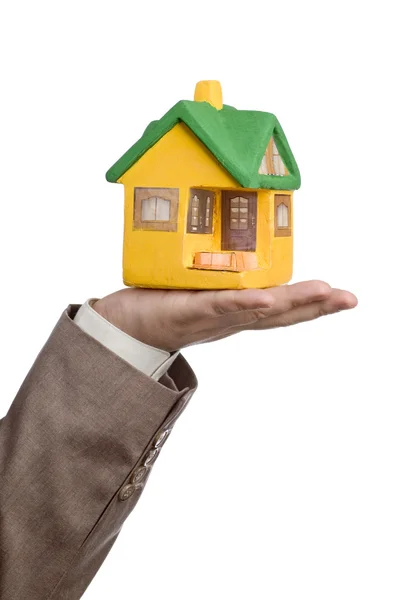 Small model house on a male hand — Stock Photo, Image