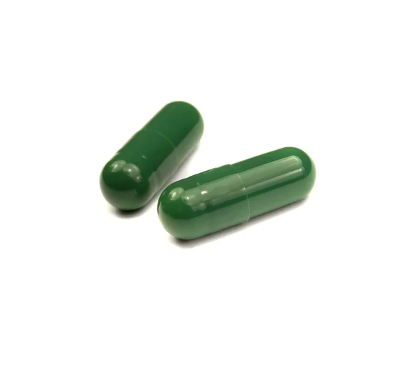 Twee groene pillen — Stockfoto
