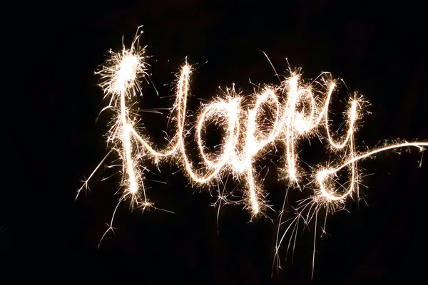 Word Happy made by sparkler — Stock Photo, Image