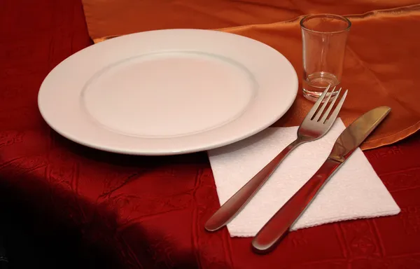 stock image White dish with fork and knife