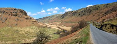 Panoramic narrow country road in Wales. clipart