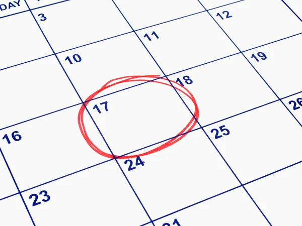 Uma data circulada em um calendário . — Fotografia de Stock