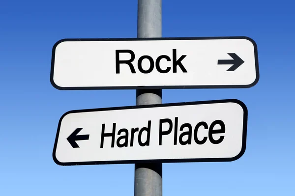 Between a rock and a hard place. Stock Photo