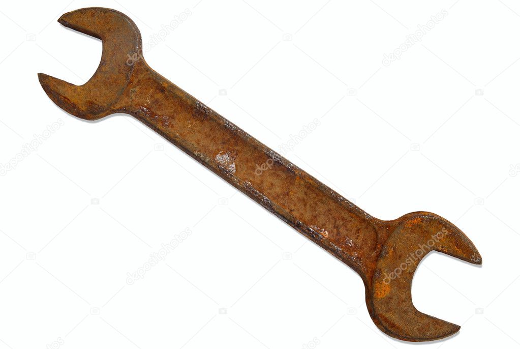 Rusty old spanner isolated.