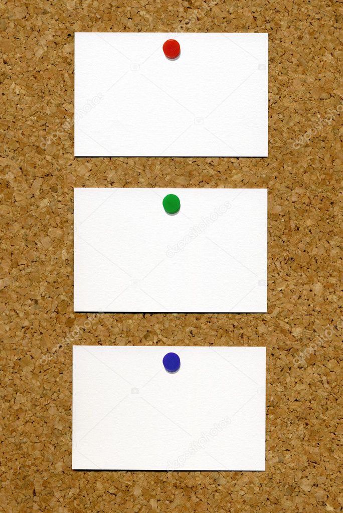 Three blank white business cards.