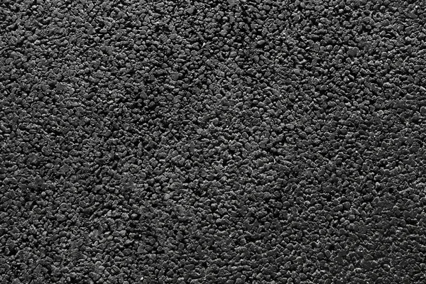 Блестящая новая чёрная асфальтовая текстура — стоковое фото