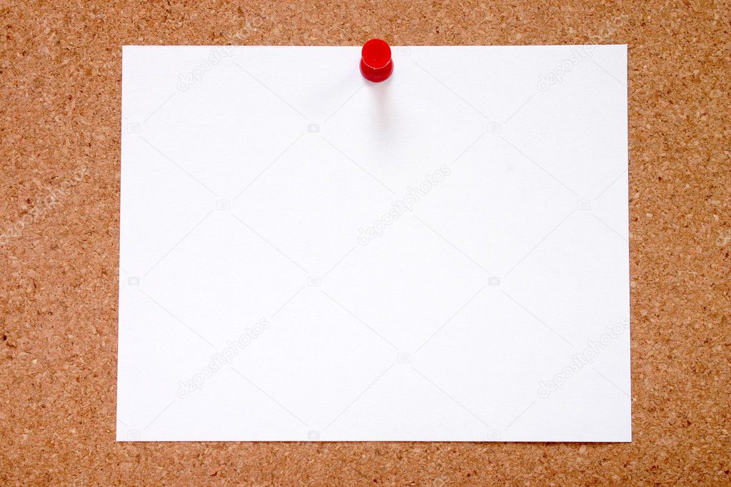 Blank paper stuck to a notice board.