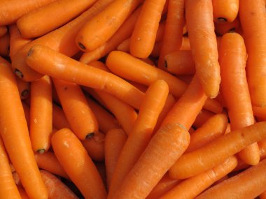 Lots of raw carrots close up. clipart