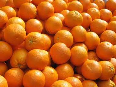 Lots of fresh oranges fruit close up. clipart