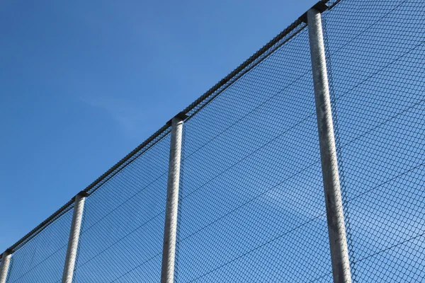 Stock image Big wire chain security fence.