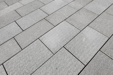 Large grey paving slabs close up. clipart