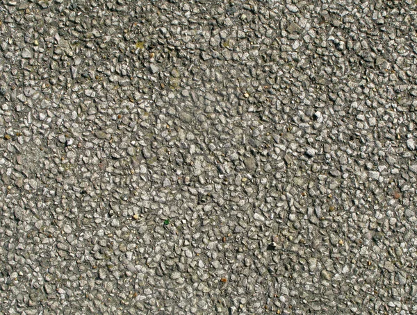 Old tarmac road stones texture. — Stock Photo, Image