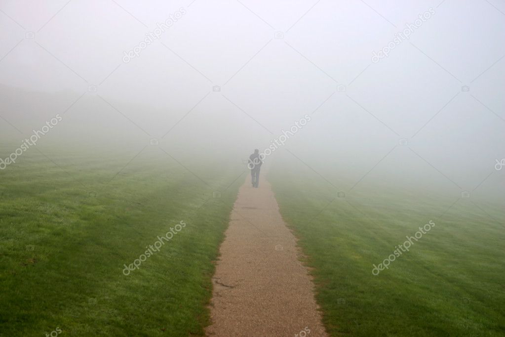 A man walking in to the mist