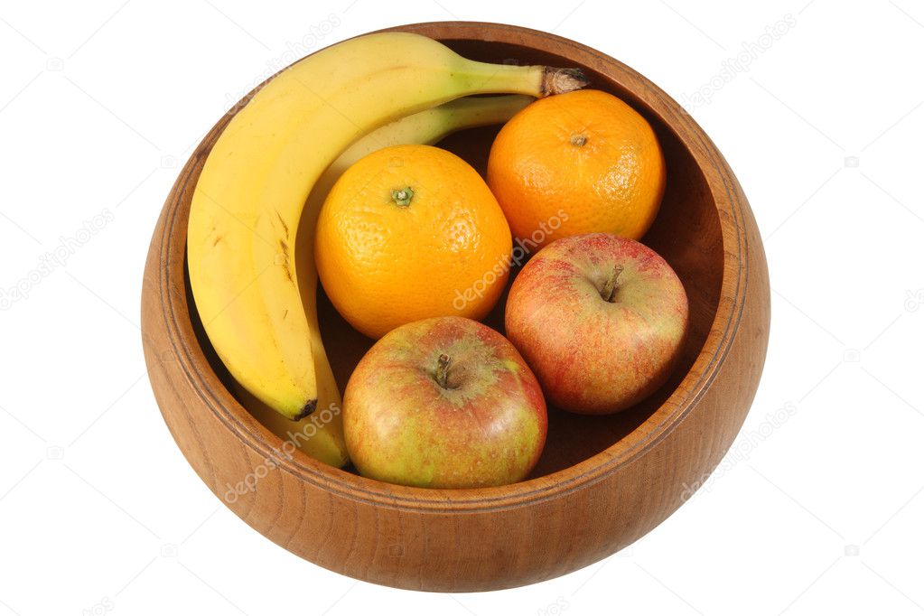 Fruit in wooden bowl isolated.