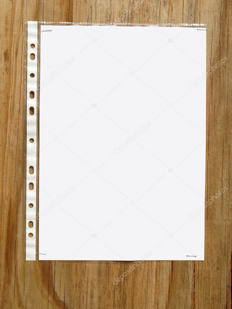 Blank paper stapled to wood.