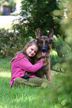 The girl and a German shepherd clipart