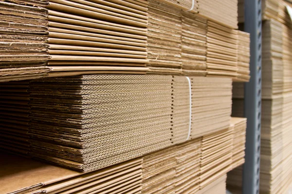 Shelves with packaging carboard close-up — Stock Photo, Image