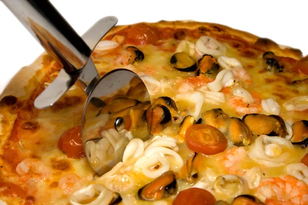 stock image Seafood pizza and cutter close-up