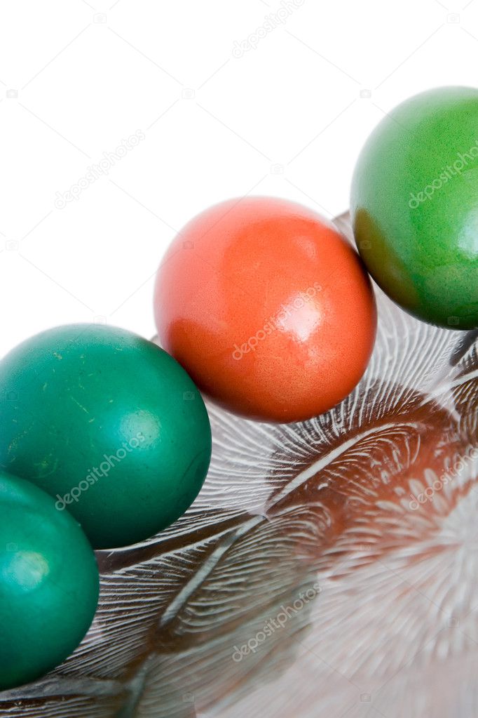 Four colored eggs on a plate