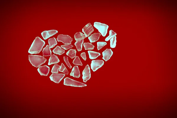Broken crystall heart on red — Stock Photo, Image