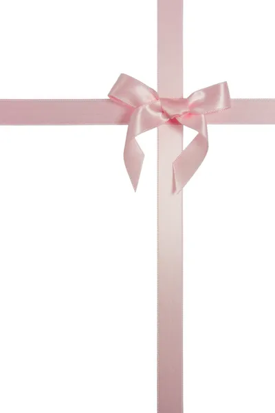 Розовая крестовая лента с изолированным луком — стоковое фото