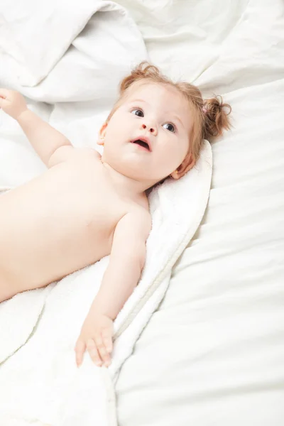 Baby girl in bed — Stock Photo, Image