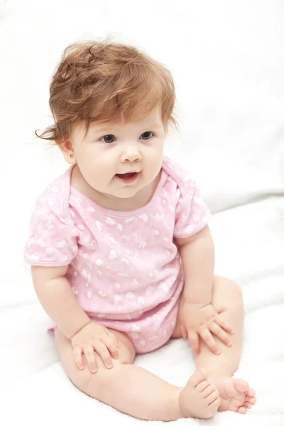 Baby girl in bed. Soft focus. Royalty Free Stock Images