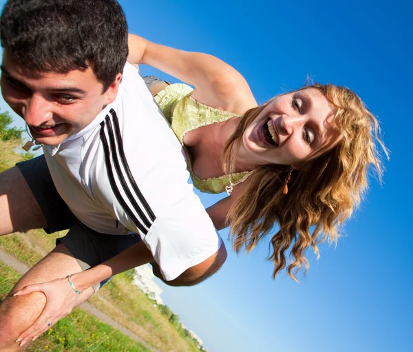 Couple fooling around outdoors — Stock Photo, Image