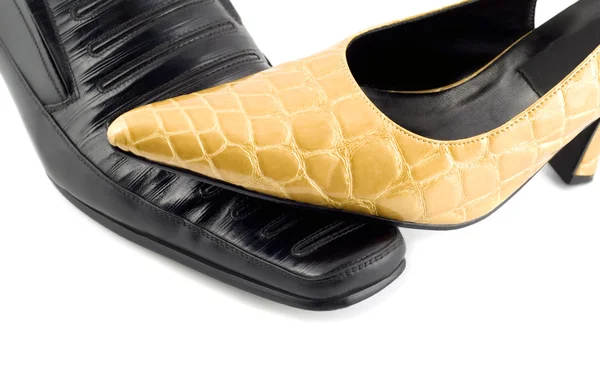 Black male shoe and yellow female shoe i — Stock Photo, Image