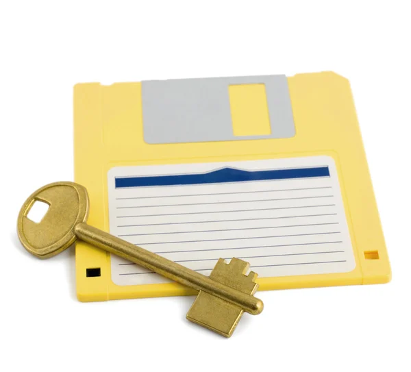 Clé sur la protection de symbole de disquette — Photo
