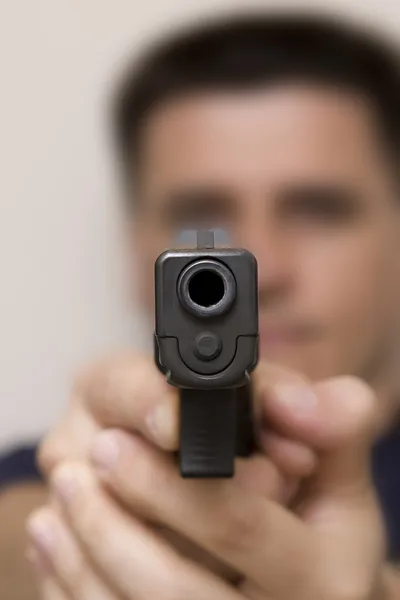 Man pointing a gun. — Stock Photo, Image