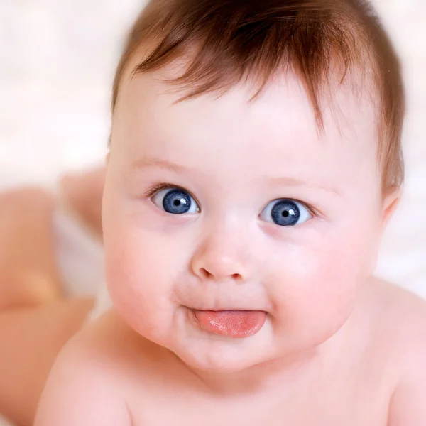 Baby with kisses — Stock Photo, Image