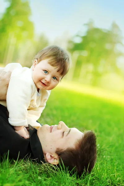 Father and son on the grass — Stock Photo, Image